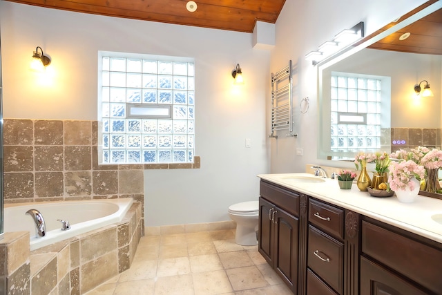 1745 W Cornelia Ave, Chicago, IL 60657 - full bath featuring radiator, a bath, double vanity, and a towel warmer