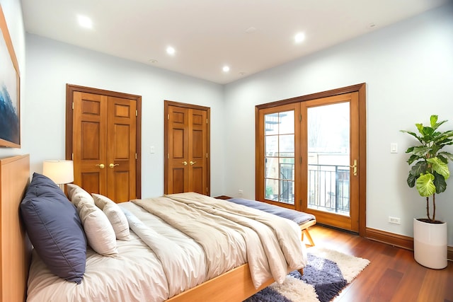 1745 W Cornelia Ave, Chicago, IL 60657 - bedroom with access to exterior, wood finished floors, two closets, and recessed lighting