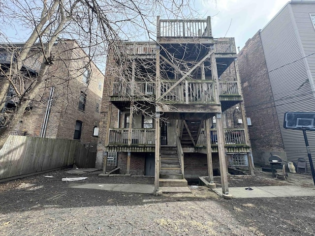 5014 S Prairie Ave Unit 1, Chicago, IL 60615 - back of property with stairs, fence, and a deck