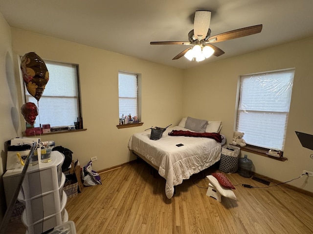 5014 S Prairie Ave Unit 1, Chicago, IL 60615 - bedroom featuring wood finished floors, baseboards, and a ceiling fan