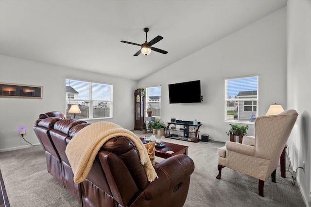 carpeted living area featuring high vaulted ceiling, baseboards, and ceiling fan