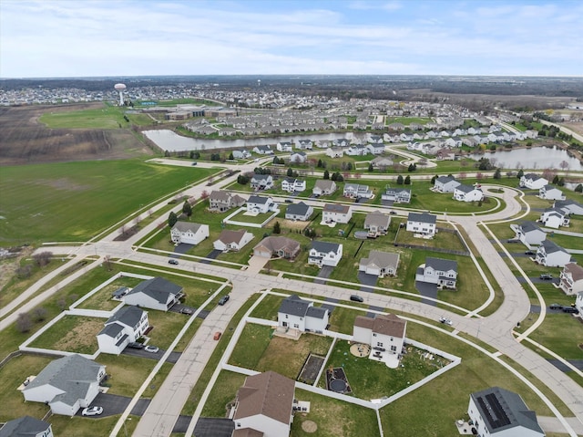 aerial view with a residential view and a water view