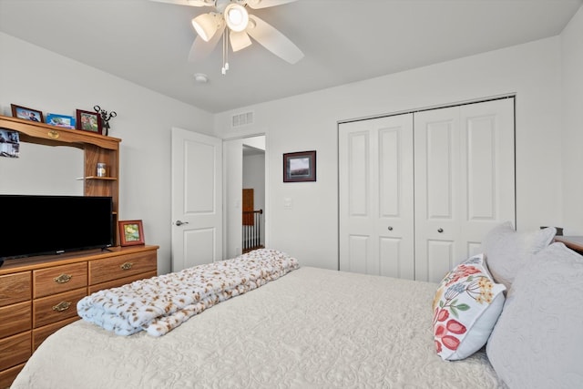 bedroom featuring a closet, visible vents, and a ceiling fan