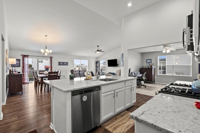 kitchen featuring stove, a sink, stainless steel dishwasher, and ceiling fan with notable chandelier