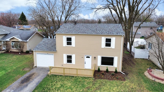919 Dartmouth Ave, Matteson, IL 60443 - view of front of home with a front yard, fence, aphalt driveway, a shingled roof, and a garage