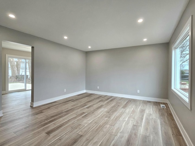 919 Dartmouth Ave, Matteson, IL 60443 - spare room with baseboards, visible vents, and light wood-style floors