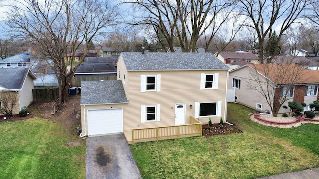 919 Dartmouth Ave, Matteson, IL 60443 - view of front facade with aphalt driveway, an attached garage, a front yard, a residential view, and a shingled roof