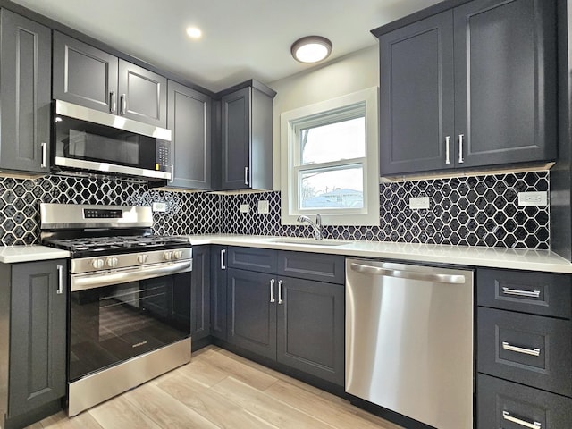 919 Dartmouth Ave, Matteson, IL 60443 - kitchen featuring backsplash, light countertops, a sink, and stainless steel appliances