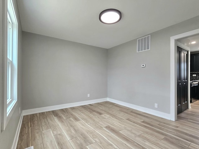 919 Dartmouth Ave, Matteson, IL 60443 - empty room featuring light wood-type flooring, baseboards, and visible vents