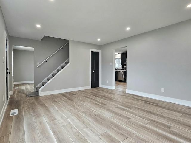 919 Dartmouth Ave, Matteson, IL 60443 - unfurnished living room featuring visible vents, recessed lighting, and light wood-type flooring