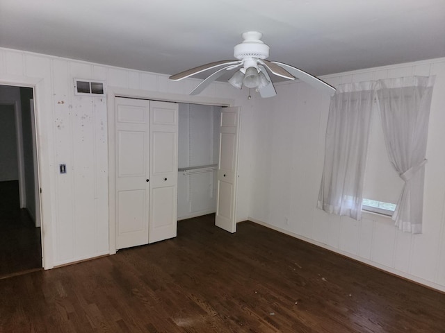 1122 Foster Ave, Lake Bluff, IL 60044 - unfurnished bedroom featuring dark wood-type flooring, a closet, a ceiling fan, and visible vents