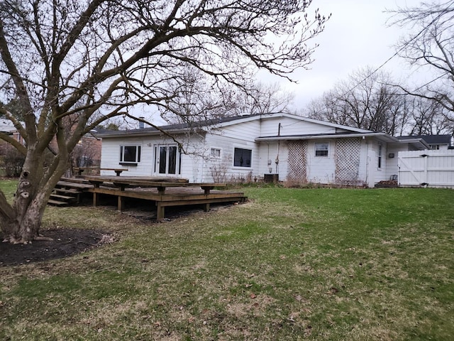 1122 Foster Ave, Lake Bluff, IL 60044 - rear view of house featuring a gate, fence, a deck, and a lawn