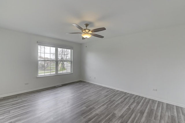 12525 S Central Park Ave, Alsip, IL 60803 - spare room with baseboards, wood finished floors, and a ceiling fan