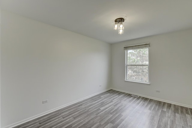 12525 S Central Park Ave, Alsip, IL 60803 - spare room with baseboards, visible vents, and wood finished floors