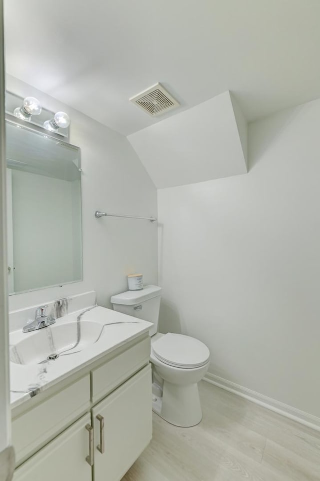 12525 S Central Park Ave, Alsip, IL 60803 - bathroom featuring visible vents, baseboards, toilet, wood finished floors, and vanity