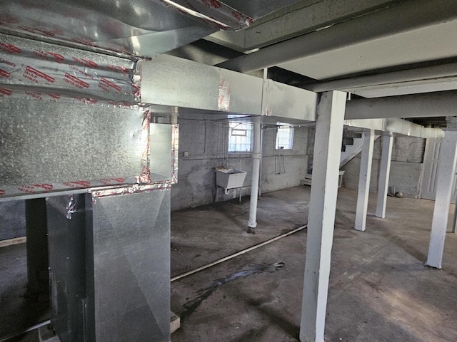 below grade area with stairs and a sink