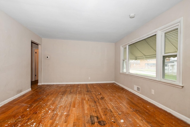 674 Memorial Dr, Calumet City, IL 60409 - spare room with hardwood / wood-style floors, baseboards, and visible vents