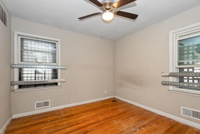 674 Memorial Dr, Calumet City, IL 60409 - spare room featuring visible vents, ceiling fan, wood finished floors, and baseboards