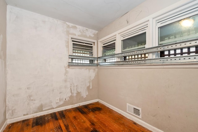 674 Memorial Dr, Calumet City, IL 60409 - spare room featuring visible vents, hardwood / wood-style flooring, and baseboards