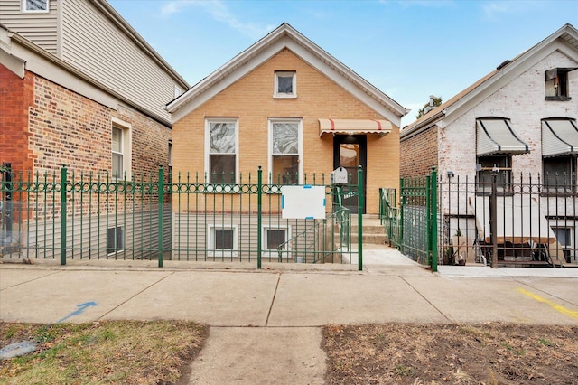 3338 S Bell Ave, Chicago, IL 60608 - view of front of house with brick siding and a fenced front yard