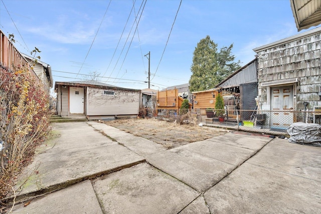 3338 S Bell Ave, Chicago, IL 60608 - view of yard with an outbuilding, fence, and a patio area