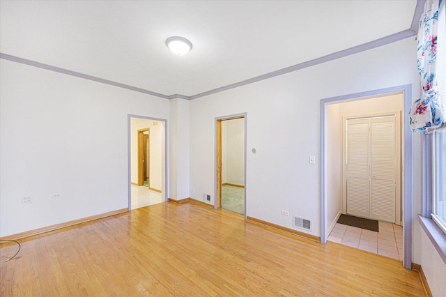 3338 S Bell Ave, Chicago, IL 60608 - unfurnished room with baseboards, visible vents, crown molding, and wood finished floors