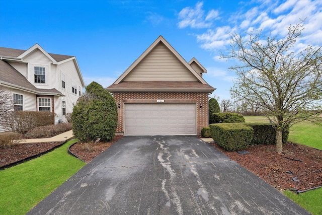 286 Sunset Blvd, Beecher, IL 60401 - traditional-style home featuring an attached garage, driveway, and brick siding