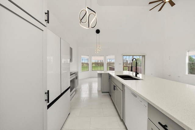 286 Sunset Blvd, Beecher, IL 60401 - kitchen with hanging light fixtures, white dishwasher, a sink, gray cabinets, and light stone counters