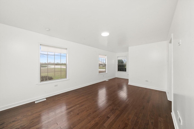286 Sunset Blvd, Beecher, IL 60401 - empty room with visible vents, baseboards, and dark wood-style floors