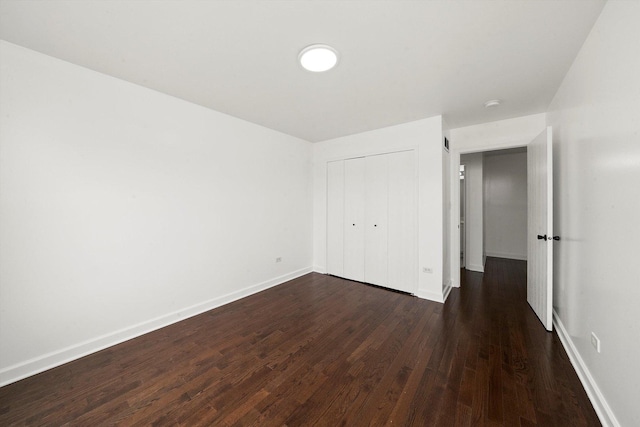 286 Sunset Blvd, Beecher, IL 60401 - unfurnished bedroom with a closet, dark wood-type flooring, and baseboards