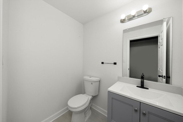 286 Sunset Blvd, Beecher, IL 60401 - bathroom featuring toilet, vanity, and baseboards