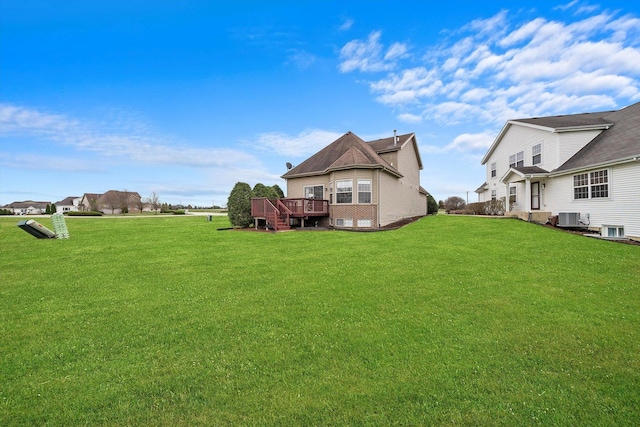 286 Sunset Blvd, Beecher, IL 60401 - exterior space featuring a yard, central AC unit, and a wooden deck