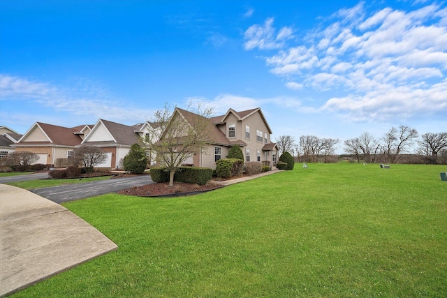 286 Sunset Blvd, Beecher, IL 60401 - view of side of home featuring a yard, aphalt driveway, a garage, and a residential view