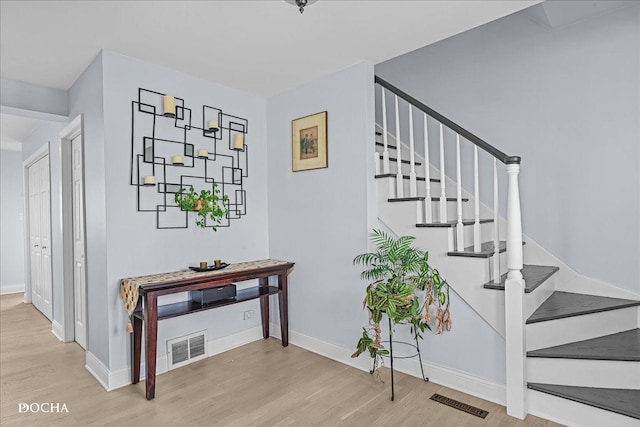 6914 Richmond Ave, Darien, IL 60561 - stairs with visible vents, baseboards, and wood finished floors