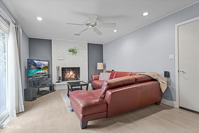 6914 Richmond Ave, Darien, IL 60561 - living room featuring a ceiling fan, light wood finished floors, a fireplace, recessed lighting, and ornamental molding
