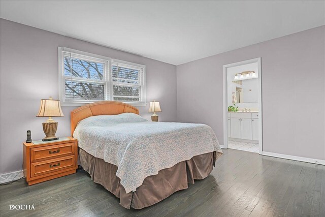 6914 Richmond Ave, Darien, IL 60561 - bedroom featuring baseboards, connected bathroom, and wood finished floors