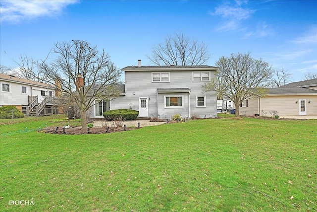 6914 Richmond Ave, Darien, IL 60561 - back of house with a chimney and a yard