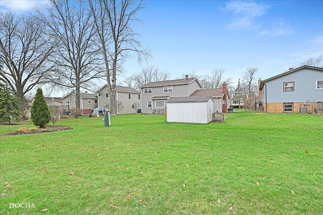 6914 Richmond Ave, Darien, IL 60561 - view of yard with an outbuilding, central air condition unit, a residential view, and a shed