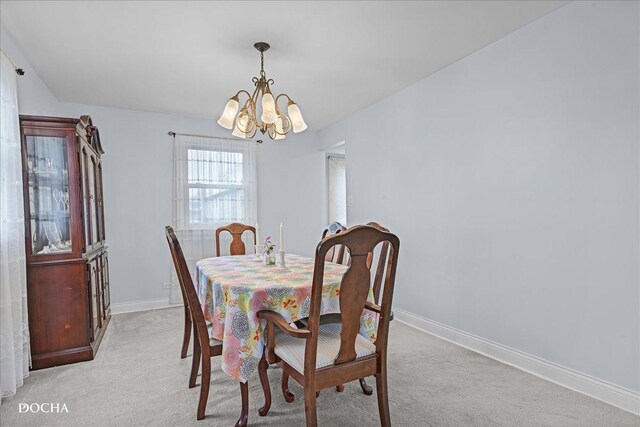 6914 Richmond Ave, Darien, IL 60561 - dining room featuring light colored carpet, baseboards, and a chandelier