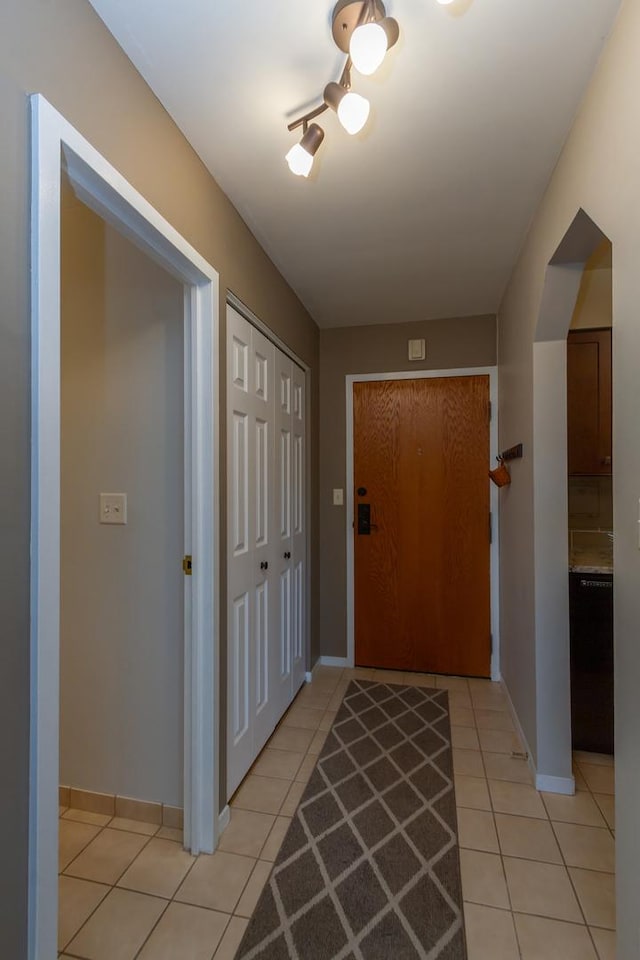 1505 E Central Rd Unit 211B, Arlington Heights, IL 60005 - entrance foyer with light tile patterned flooring and baseboards