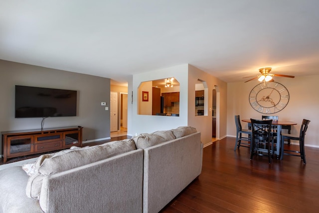 1505 E Central Rd Unit 211B, Arlington Heights, IL 60005 - living area featuring dark wood finished floors, a ceiling fan, and baseboards