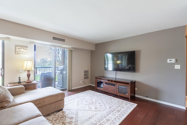 1505 E Central Rd Unit 211B, Arlington Heights, IL 60005 - living room with baseboards and wood finished floors