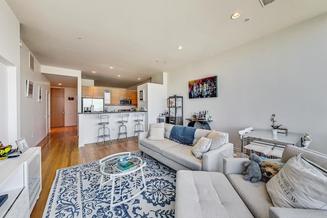 500 W Superior St Unit 1804, Chicago, IL 60654 - living room featuring light wood-style floors, recessed lighting, and baseboards