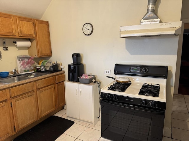 4221 N Sawyer Ave, Chicago, IL 60618 - kitchen featuring range with gas cooktop, ventilation hood, brown cabinets, and a sink