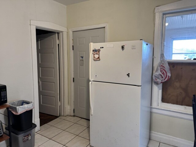 4221 N Sawyer Ave, Chicago, IL 60618 - kitchen with freestanding refrigerator and light tile patterned floors