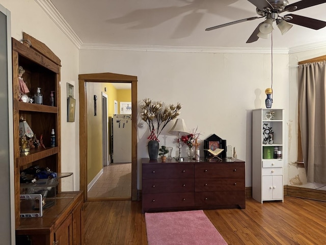 4221 N Sawyer Ave, Chicago, IL 60618 - bedroom featuring crown molding, a ceiling fan, refrigerator, and wood finished floors