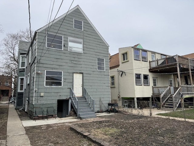 4221 N Sawyer Ave, Chicago, IL 60618 - rear view of house featuring fence