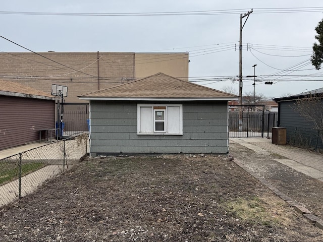 4221 N Sawyer Ave, Chicago, IL 60618 - view of property exterior featuring roof with shingles and fence
