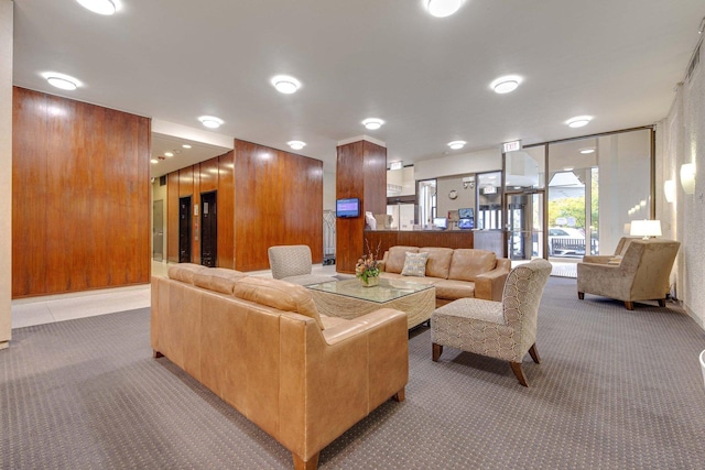 living room with carpet and expansive windows