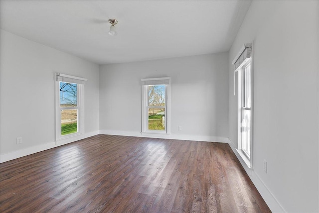 103 E 1400 N Rd, Danvers, IL 61732 - empty room featuring dark wood finished floors and baseboards